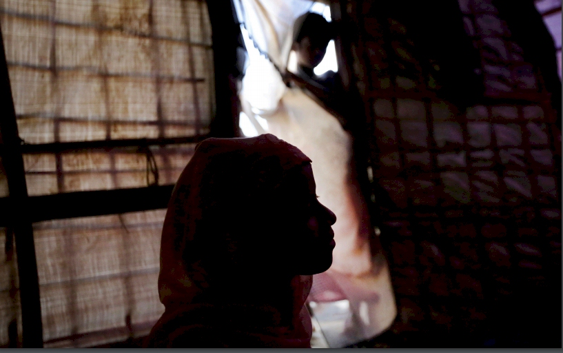 13 year-old girl, is seen in silhouette as she speaks to The Associated Press in her tent in Kutupalong refugee camp in Bangladesh. (AP Photo/Wong Maye-E)